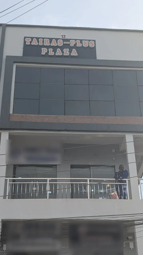 Tairas Plus Plaza, 12 Oshitelu Street, Computer Village, Ikeja, with the plaza name sign at the top